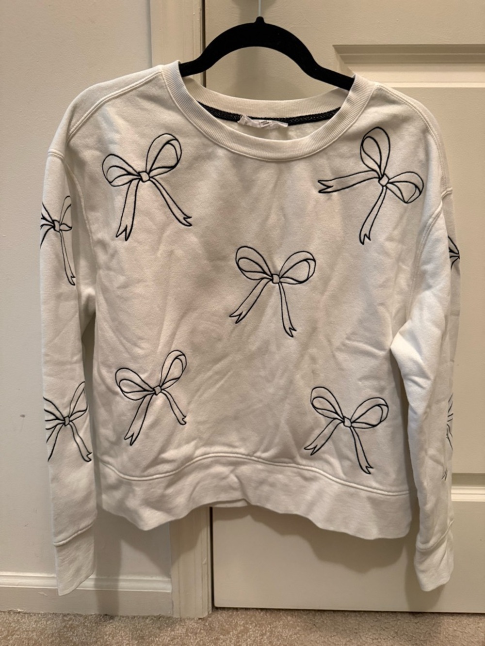 White Sweatshirt with Black Bow Print